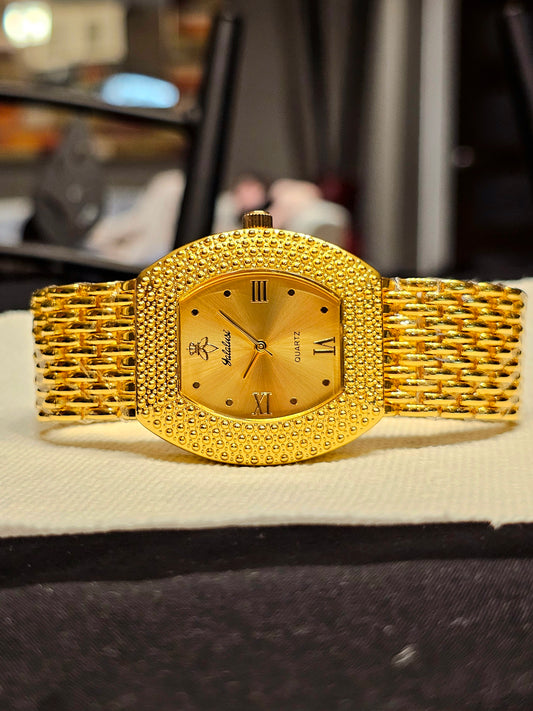 Halalassi Radiant Gold Textured Women's Watch – Bold & Elegant